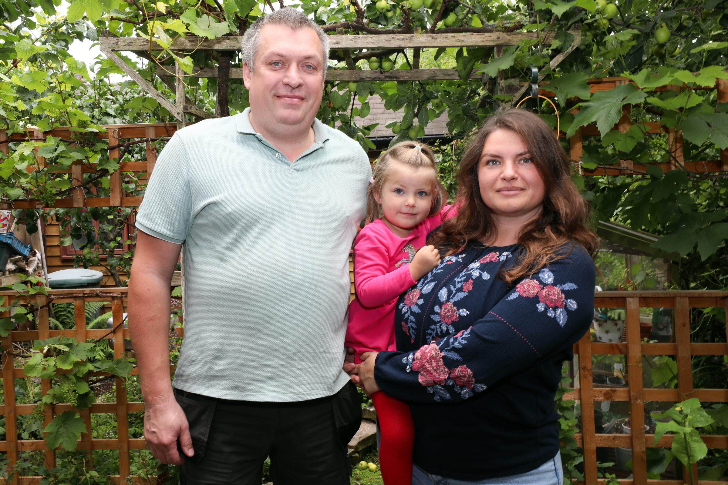 Pavlo Korniienko with his wife Olena and their three-year-old daughter, Maria.